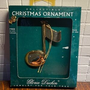 Gloria Duchin gold-toned music note collectible Christmas ornament.